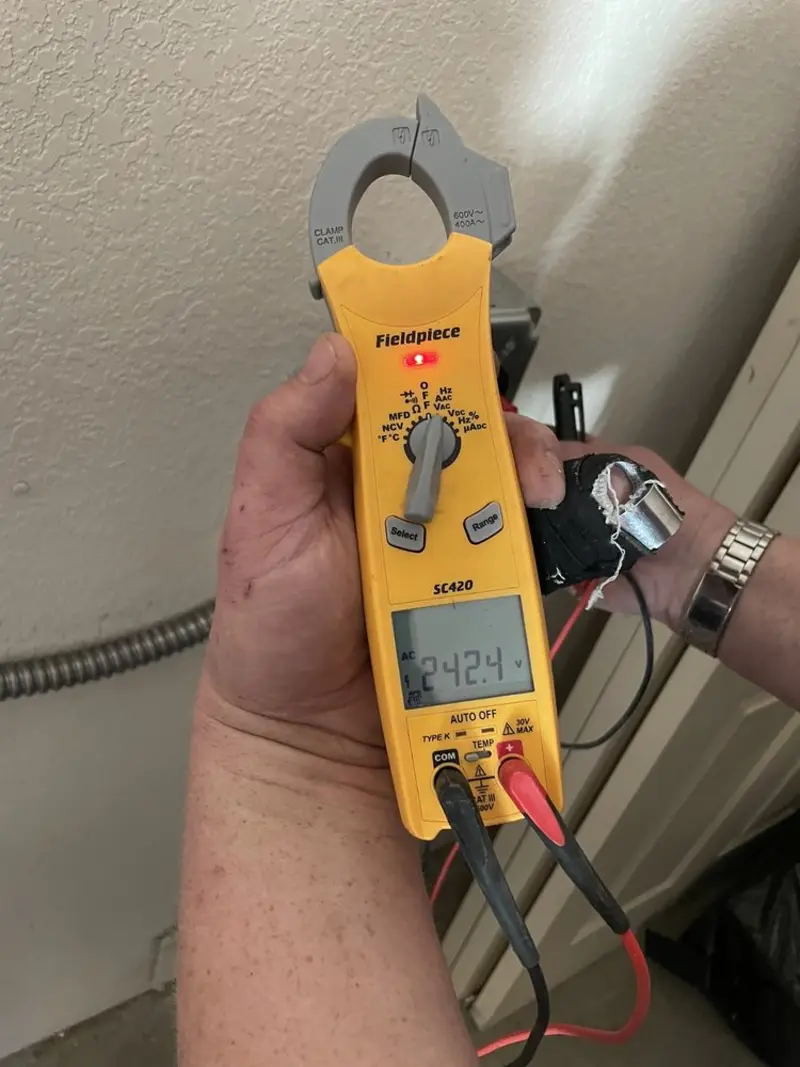 Voltage testing with clamp meter during Outlet Installation in East Hemet